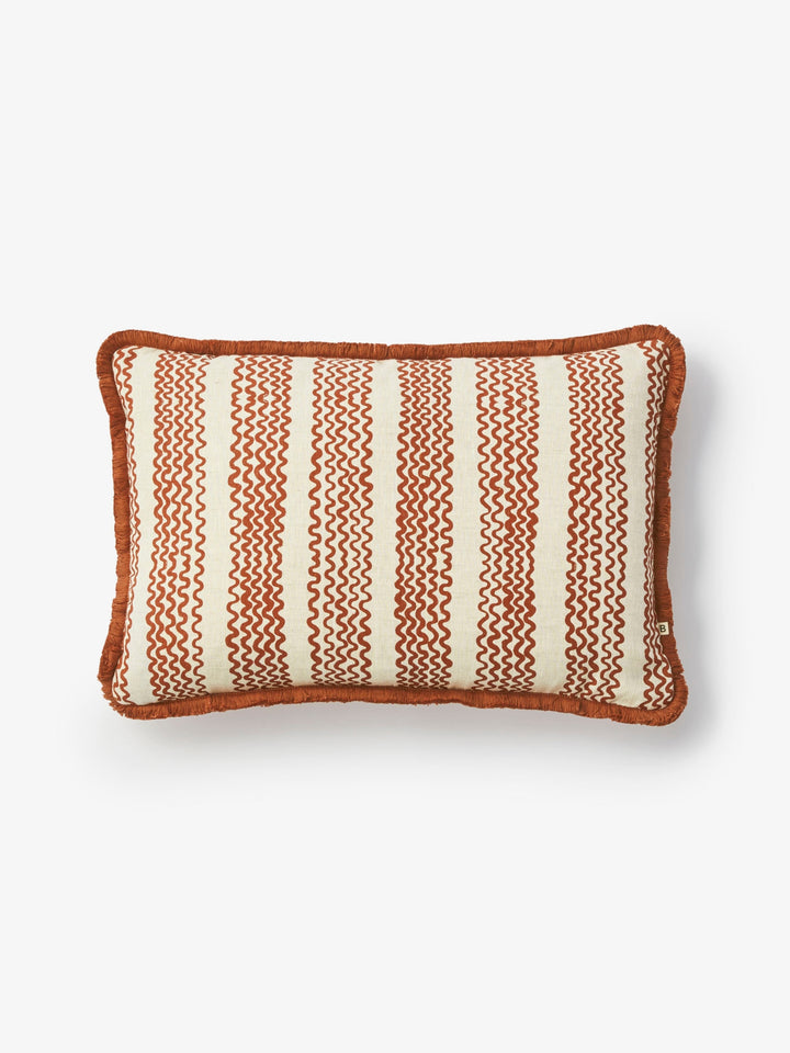 Rectangular pillow with brown and white striped pattern on a light gray background