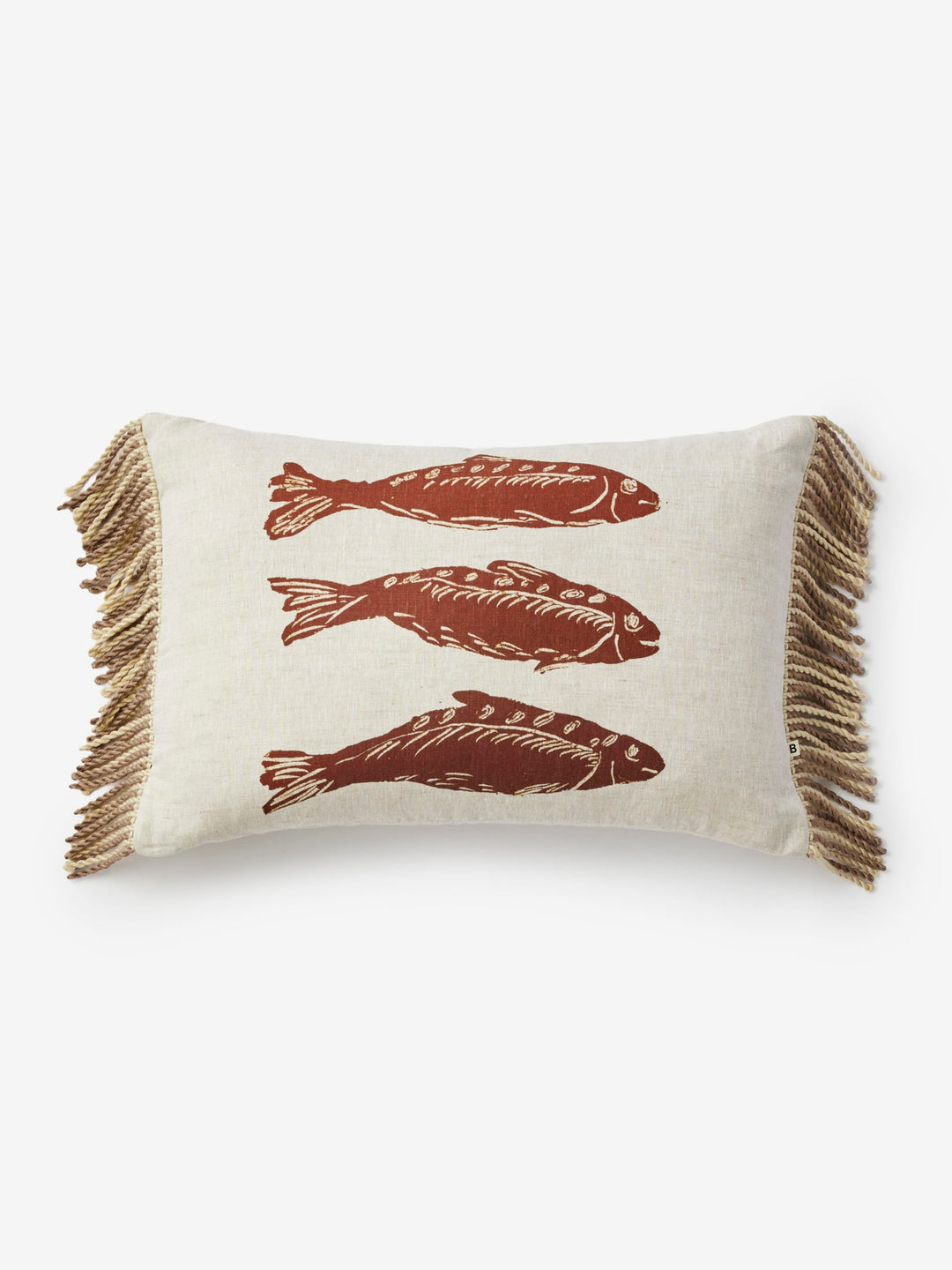 Decorative pillow with fish patterns and fringes on a white background