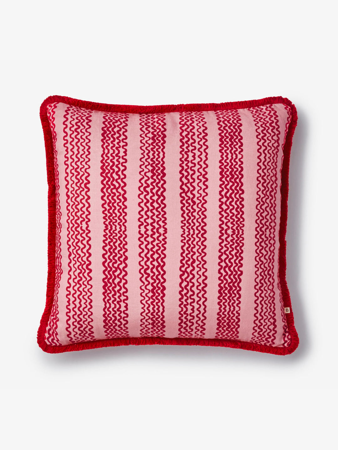 Striped red and pink pillow on a light gray background