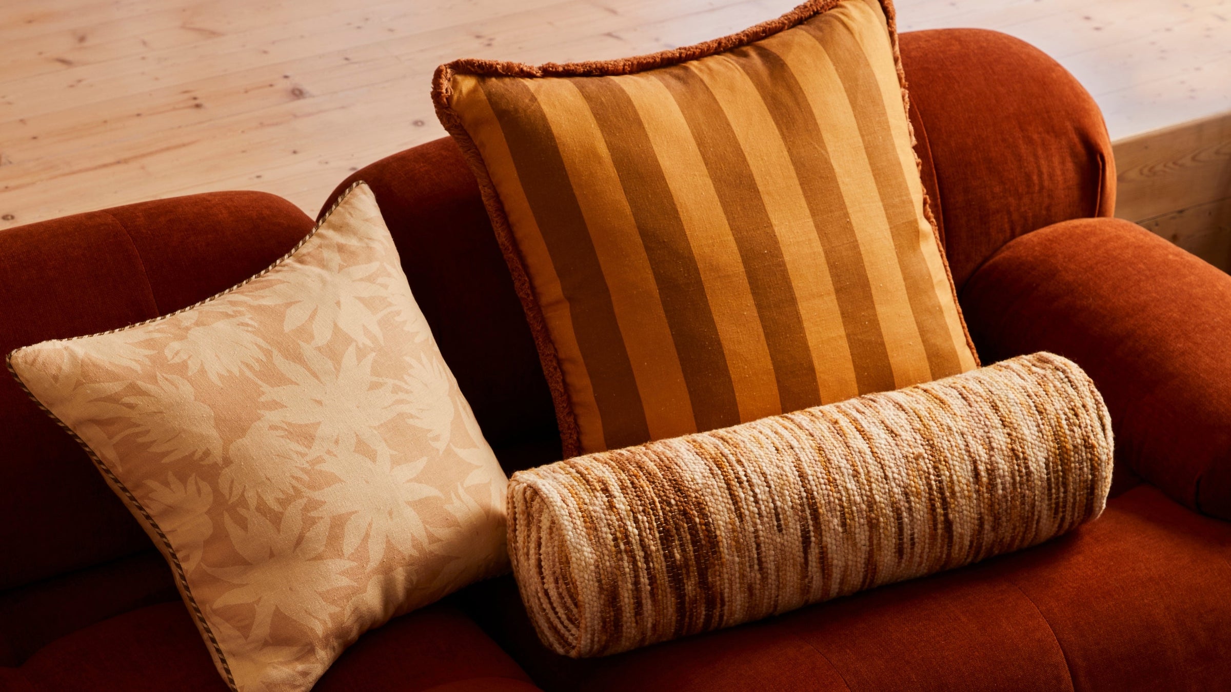 Wool Marle Cream Bolster Styled With Fleur Bone & Bold Stripe Mustard Cushions