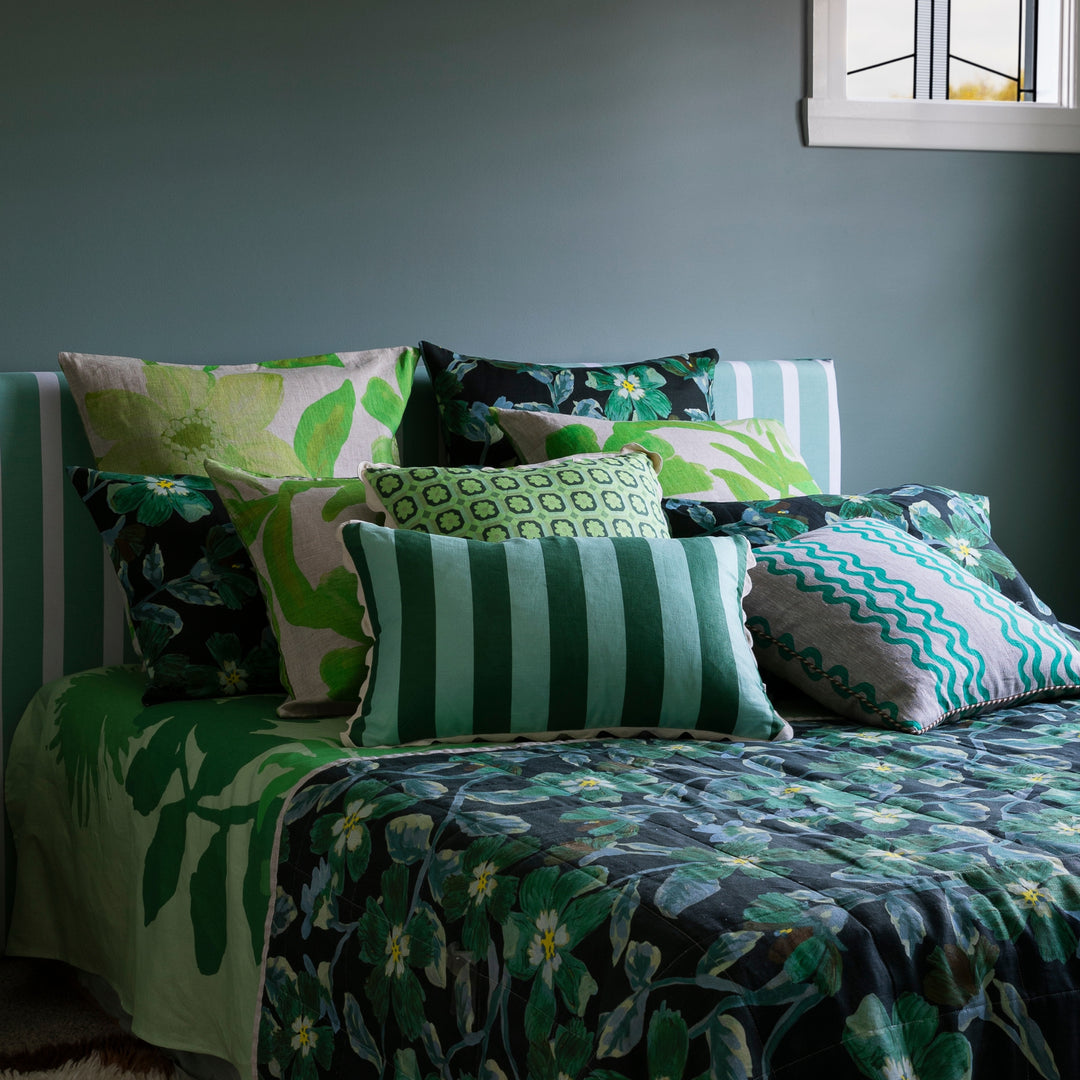 Bold Stripe Verde 60x40cm Cushion Styled On Bed With Complementary Bedding