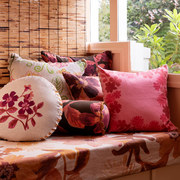 Cosmos Pink 50cm Linen Cushion Styled On Banquette Seating With Complementary Cushions