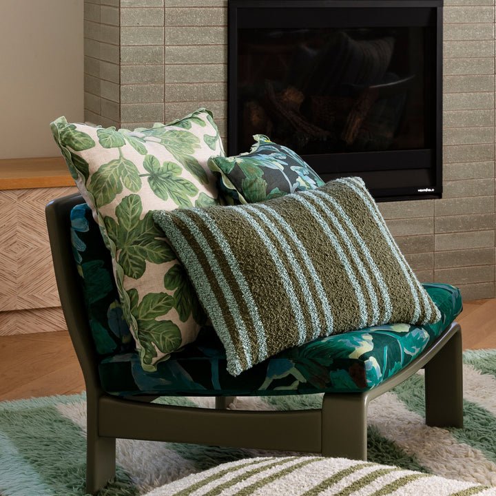 Cosmos Green 50cm Linen Cushion Styled On Green Chair With Complementary Cushions