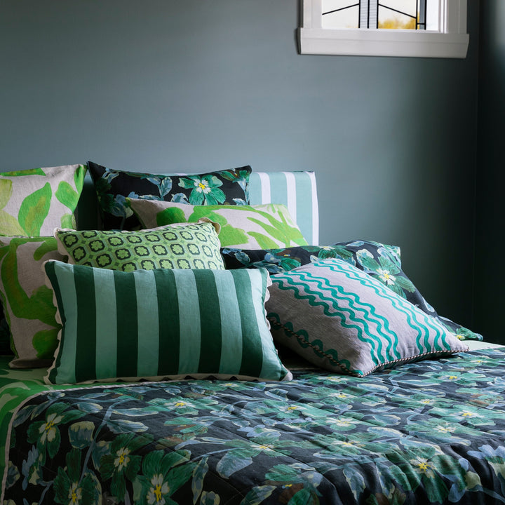 Double Waves Bright Green 50cm Linen Cushion Styled On Bed With Complementary Cushions