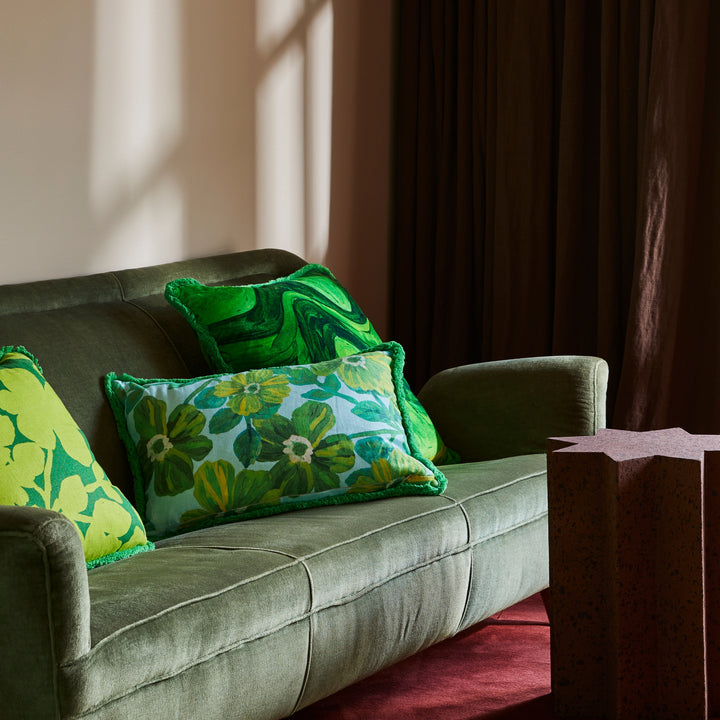 Rosetta Blue 60x40cm Cushion Styled On Green Sofa With Carmine Lime Cushion & Sway Green Velvet Cushion