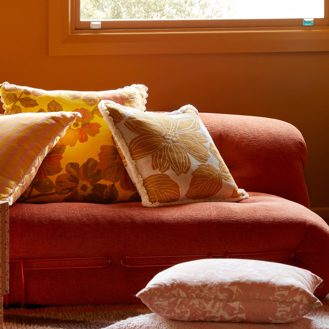 Margot Mustard 50cm Cushion Styled On Red Sofa With Rosetta Saffron Cushion