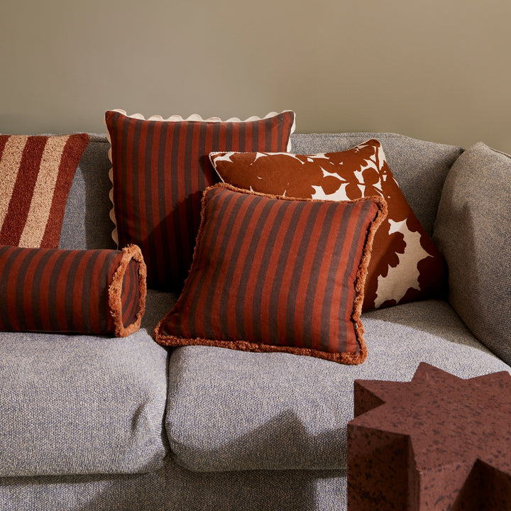 Thin Stripe Chocolate 50cm Cushion Styled On Grey Sofa With Brown Striped & Brown Floral Cushions