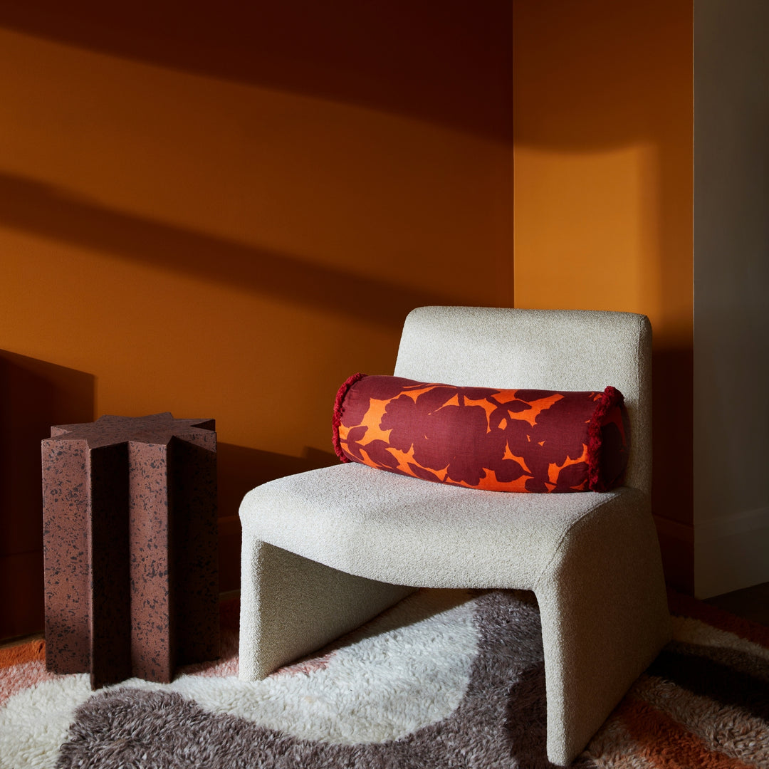 Carmine Rust 60x20cm Bolster Styled On Cream Armchair 