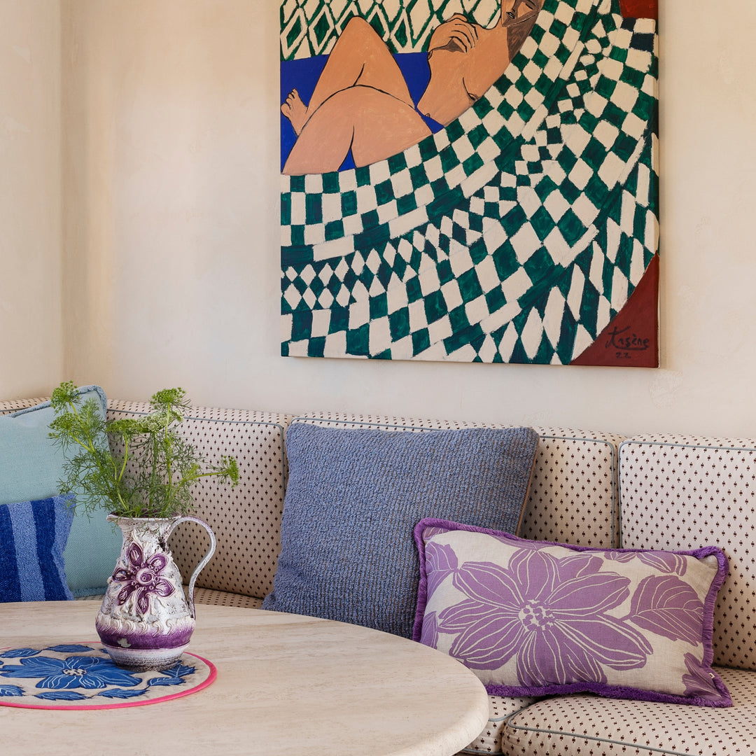 Cloud Blue 50cm Boucle Cushion Styled On Banquette Seating With Margot Lilac Cushion