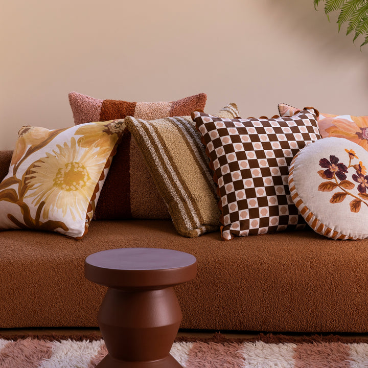 Wide Stripe Tan 60cm Boucle Cushion Styled On Brown Sofa With Complementary Cushions