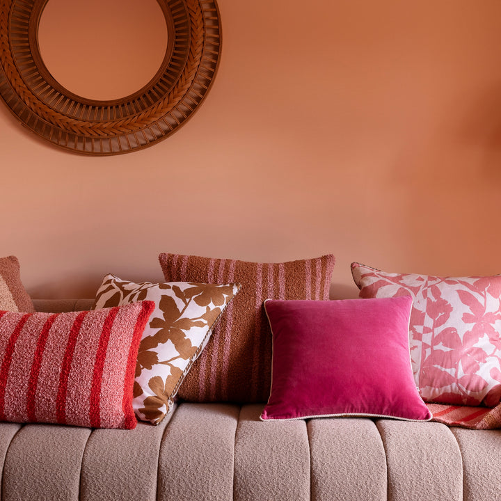 Trio Stripe Tan Pink 60cm Boucle Cushion Styled On Beige Sofa With Complementary Cushions