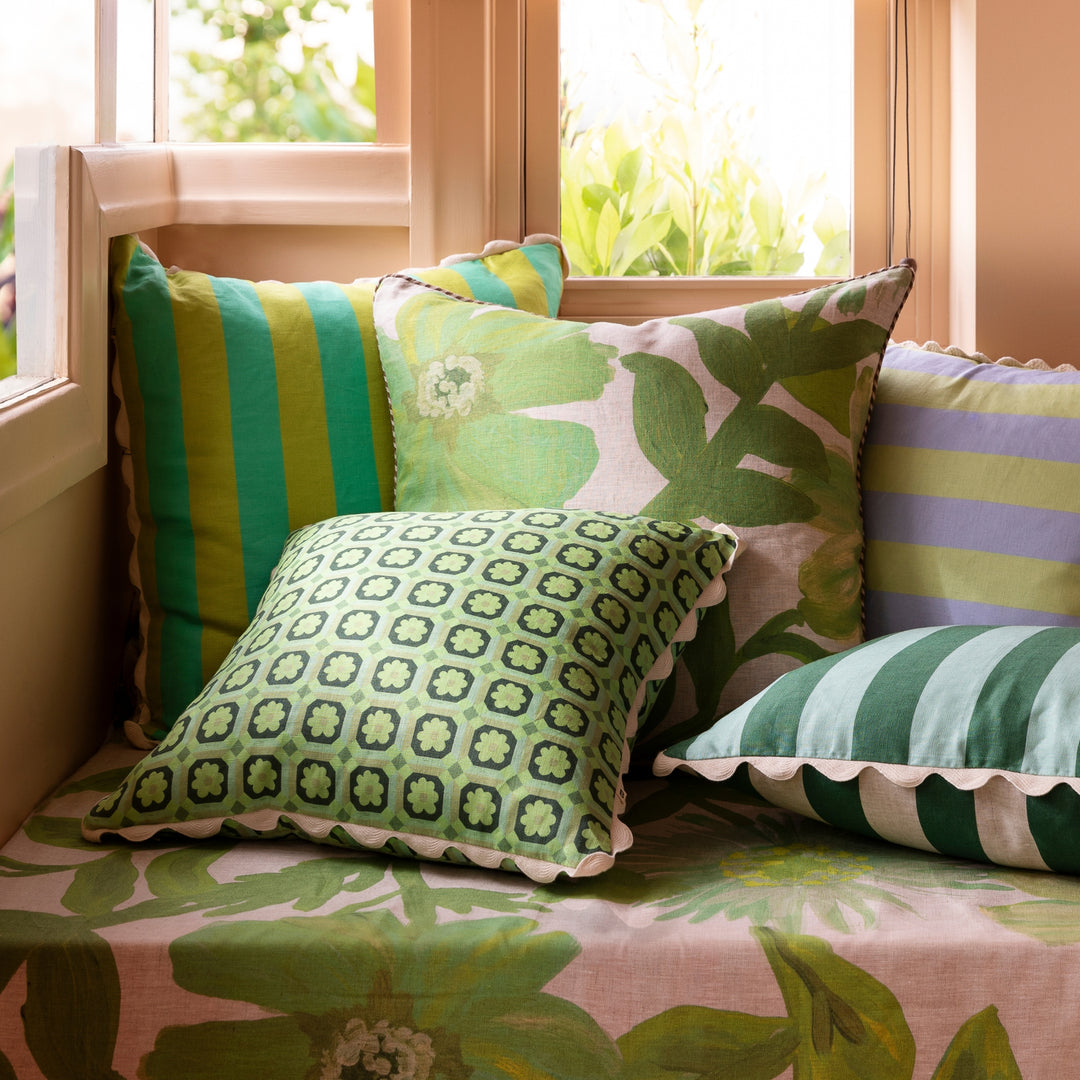 Cornflower Green 60cm Linen Cushion Styled On Banquette Seating With Complementary Cushions