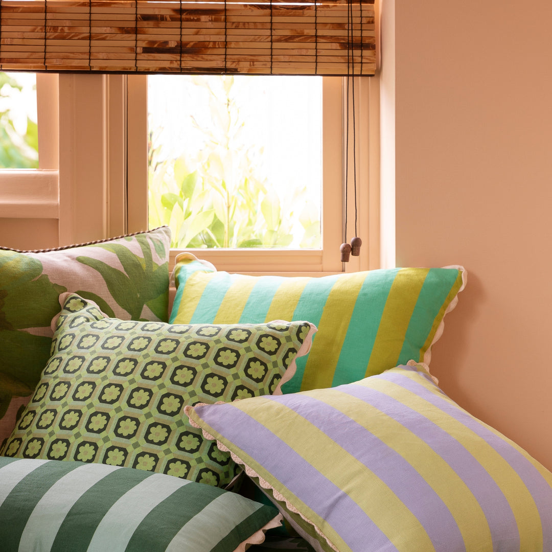 Bold Stripe Citron Jade 60cm Cushion Styled On Banquette Seating With Complementary Cushions