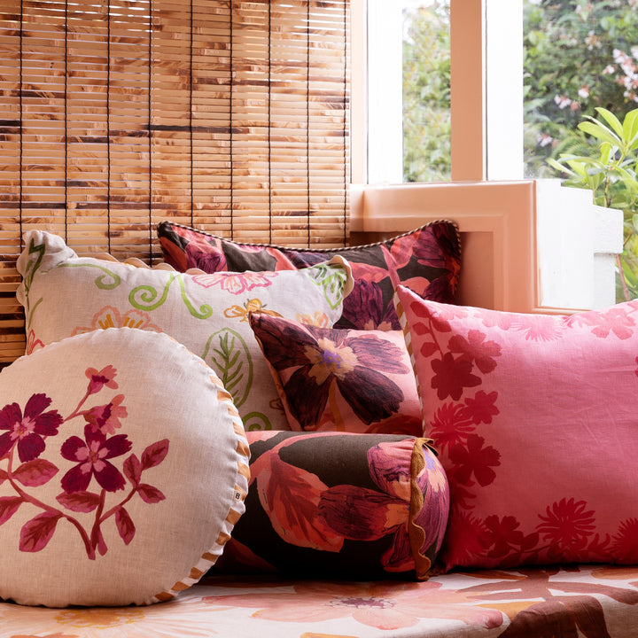 Cosmos Cerise 60cm Linen Cushion Styled On Banquette Seating With Complementary Cushions