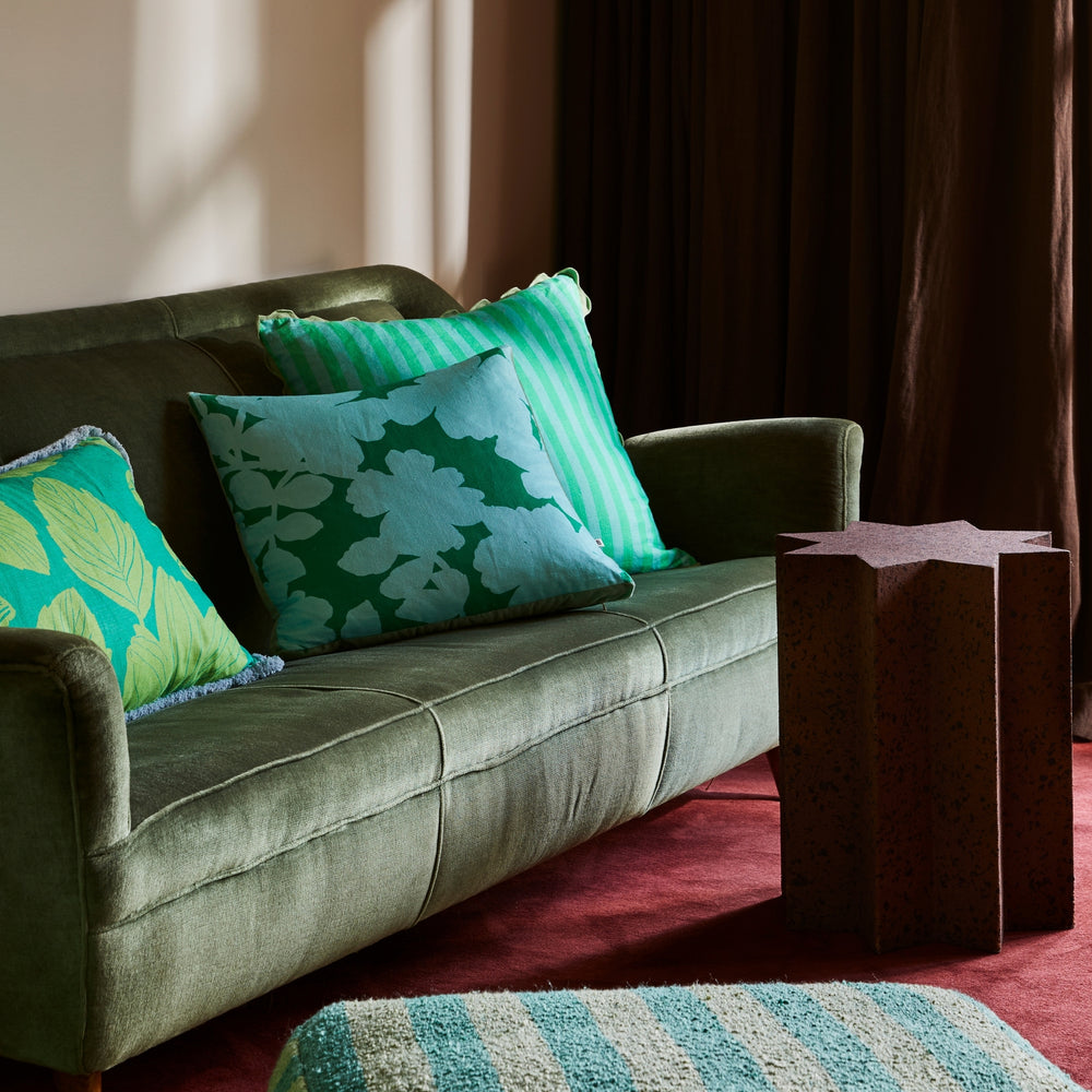 Thin Stripe Jade 60cm Cushion Styled On Green Sofa With Carmine Blue Cushion & Margot Bright Green Cushion