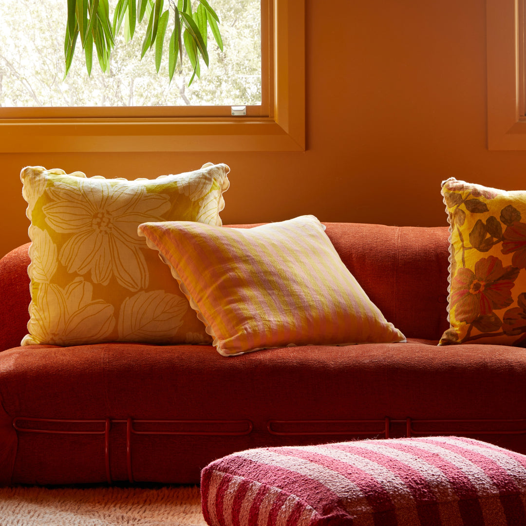 Thin Stripe Yellow 60cm Cushion Styled On Red Sofa With Margot Lemon Cushion & Rosetta Saffron Cushion