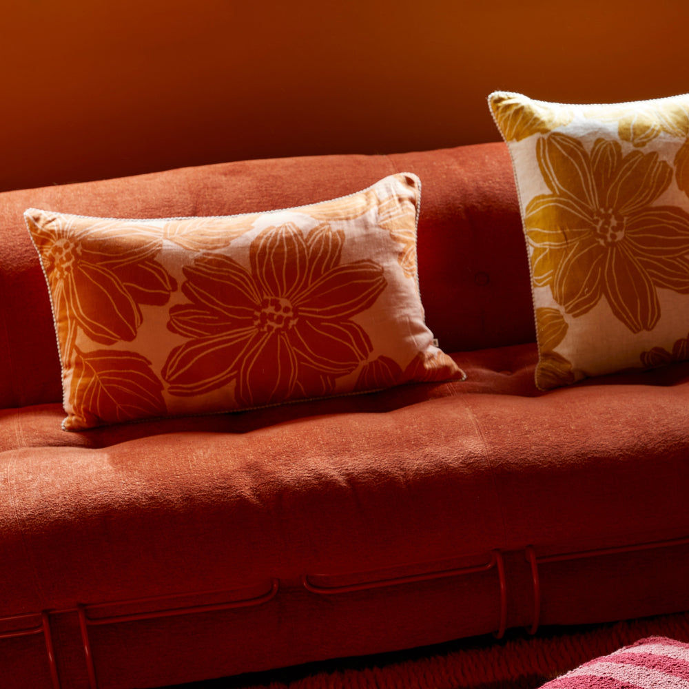 Margot Tan 60cm Cushion Styled On Red Sofa With Margot Mustard Cushion