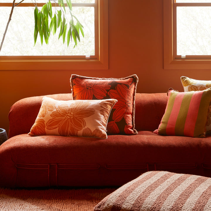 Margot Orange 60cm Cushion Styled On Red Sofa With Margot Tan Cushion