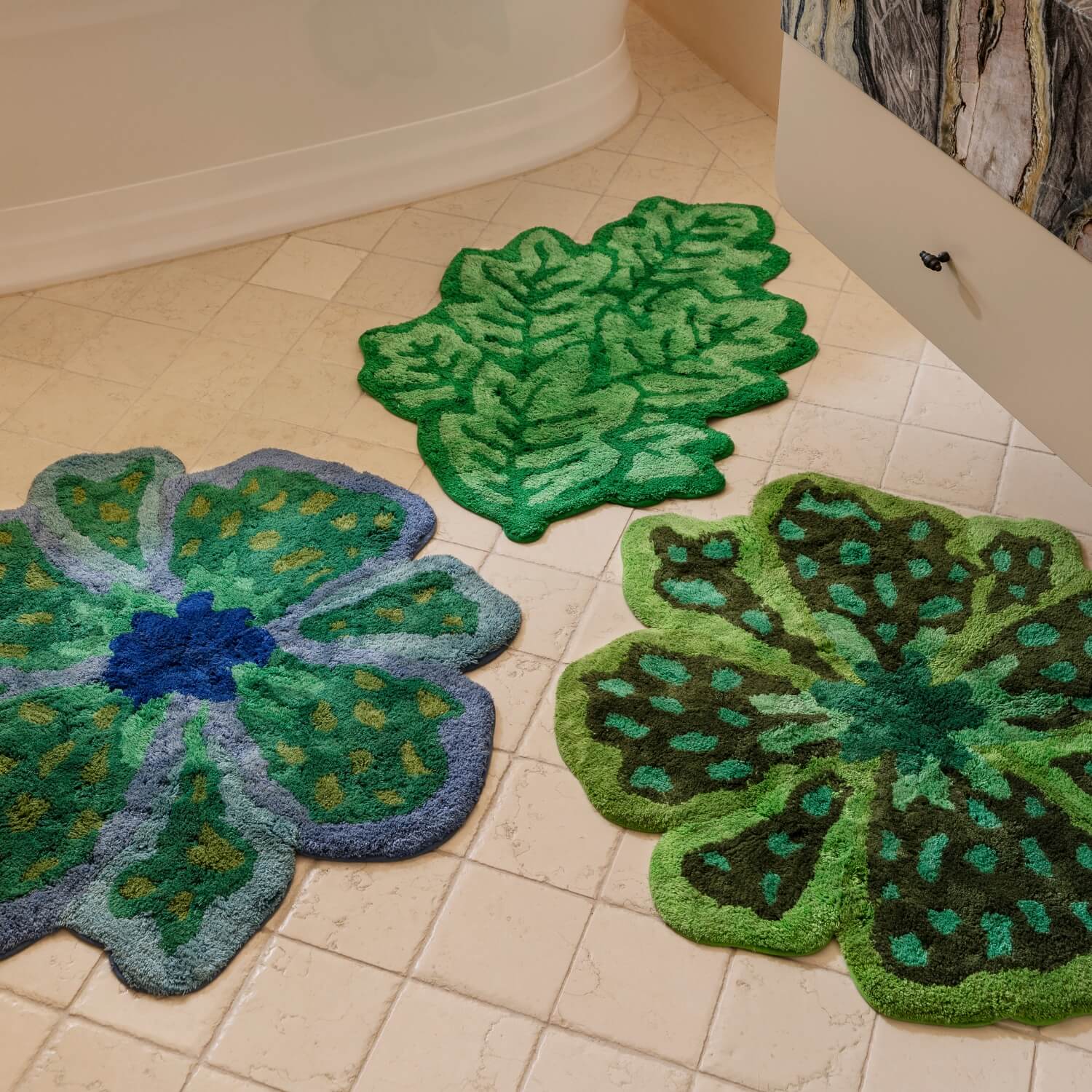 Flower Blue, Flower Green & Leaf Green Bath Mats On Tiled Bathroom Floor