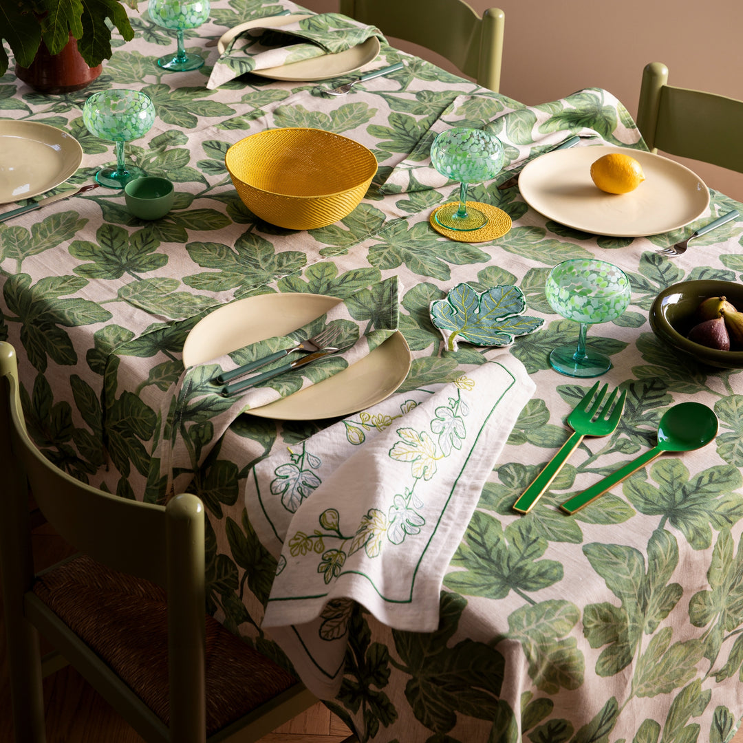 Fig Green Tablecloth Styled With Complementary Tabletop Accessories In Dining Room Setting