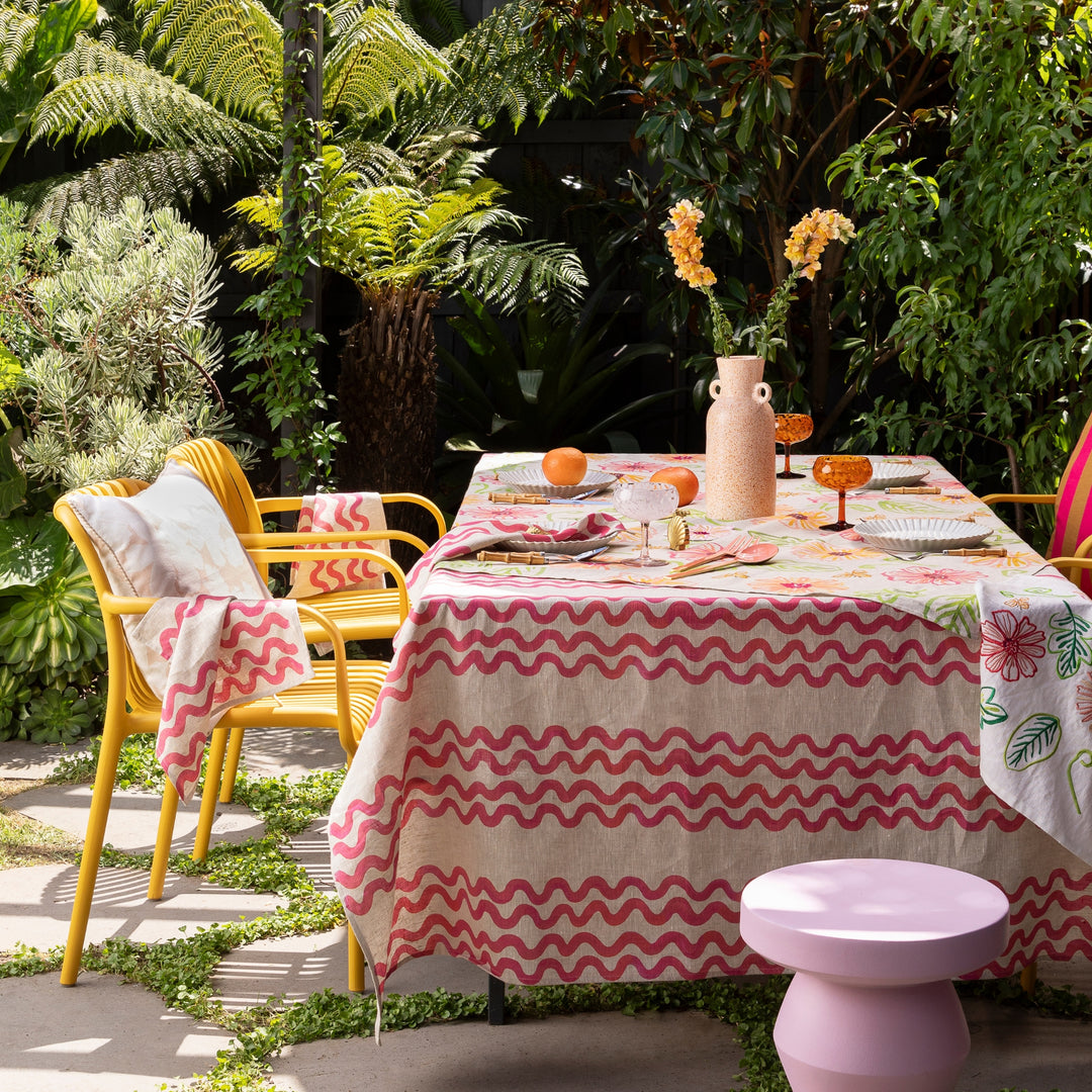 Double Waves Pink Tablecloth Styled With Complementary Tabletop Accessories In Outdoor Dining Setting