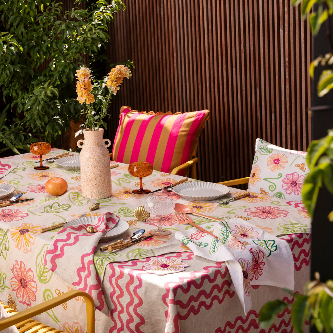 Double Waves Pink Tablecloth Styled With Complementary Tabletop Accessories In Outdoor Dining Setting