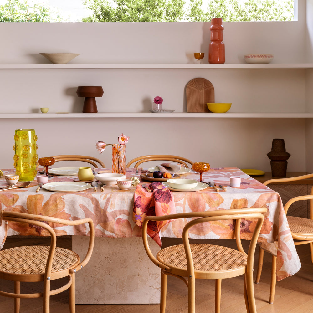 Cornflower Pink Tablecloth Styled With Complementary Tabletop Accessories In Dining Room Setting