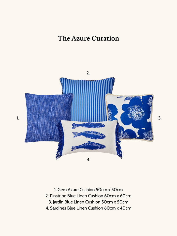 Four blue cushions with different patterns on a white background, labeled 'The Azure Curation'.
