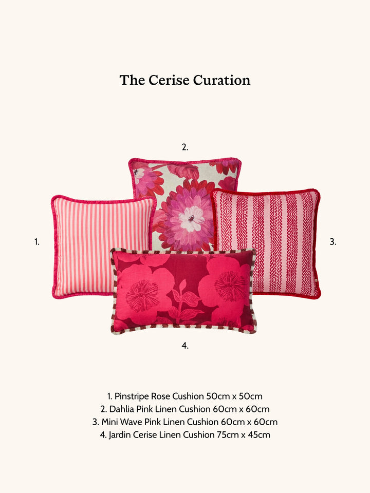 Four pink cushions with floral and striped patterns on a white background, labeled 'The Cerise Curation'.